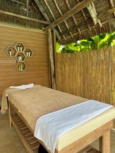 Кровать или кровати в номере Turkuaz Beach Zanzibar