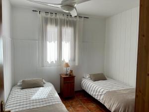 A bed or beds in a room at La casita del pueblo