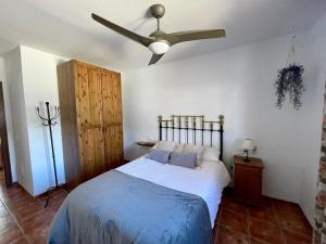 A bed or beds in a room at La casita del pueblo