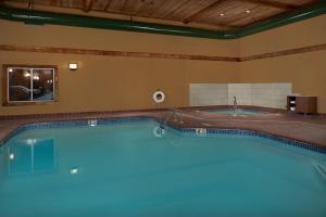 a large swimming pool in a hotel room at Holiday Inn Express Hotel & Suites Anniston/Oxford, an IHG Hotel in Oxford