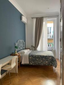 Posteľ alebo postele v izbe v ubytovaní NAPOLIFOREVER Chiaia APARTMENT