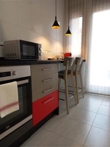 A kitchen or kitchenette at Littore TORMES con Parking, AA y Piscina
