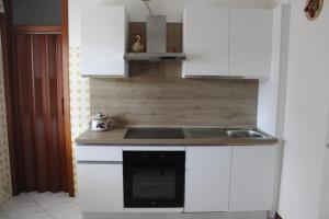 Η κουζίνα ή μικρή κουζίνα στο Moreno House - Appartamento due camere