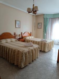 En eller flere senger på et rom på Casa Pureza
