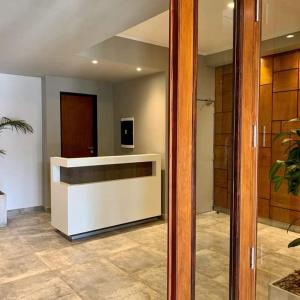 a lobby with a reception desk in a building at Monoambiente turístico la linda de Salta in Salta