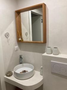 a bathroom with a sink and a mirror at "Ariane" - Afytos village with sea view in Afitos
