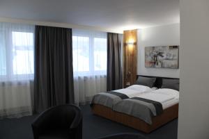 Posteľ alebo postele v izbe v ubytovaní Hotel P7