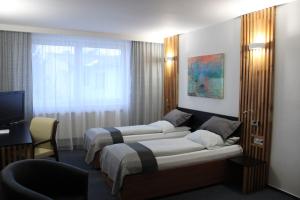 Posteľ alebo postele v izbe v ubytovaní Hotel P7