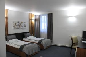 Posteľ alebo postele v izbe v ubytovaní Hotel P7
