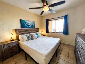 a bedroom with a bed and a ceiling fan at Princesa de Penasco Condo C101 Sandy Beach Puerto Penasco in Puerto Peñasco