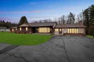a large house with a lot of windows at Luxury-Cabin Mount View *Gym*Game Room *Fire Place in Lehighton