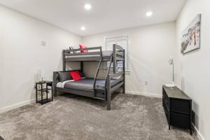 a bedroom with a bunk bed with a ladder at Luxury-Cabin Mount View *Gym*Game Room *Fire Place in Lehighton