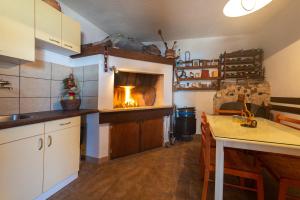 a kitchen with a fire oven in the wall at HAPPY DAYS in Trogir