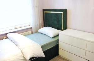 a small bedroom with a bed and a mirror at Deluxe Dwelling - 15 mins from Cork City/Airport in Cork