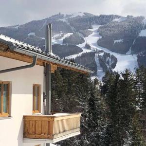 a balcony of a house with a view of a mountain at Chalet zum Wohlfühlen in Ramsau am Dachstein