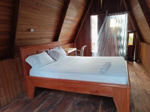 Letto o letti in una camera di Kribi-Lodge