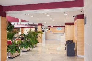 a lobby of a hospital with potted plants at Holiday Inn Express Madrid-Alcorcón, an IHG Hotel in Alcorcón