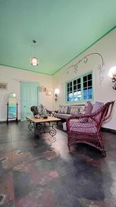 a living room with a couch and a table at Hotel San Marco  in Santo Domingo