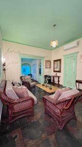 a living room with couches and a table at Hotel San Marco  in Santo Domingo