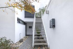a staircase leading up to a white house at Appartement Waldheim in Bad Nauheim