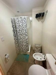 a small bathroom with a shower and a toilet at Depto en Buenos Aires, Ciudadela. in Ciudadela