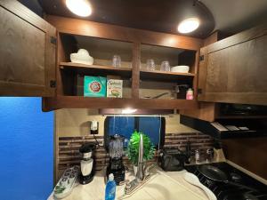 a kitchen with a sink and a counter top at The paradise in Lehigh Acres