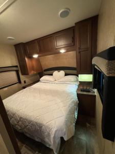 a bedroom with a bed in a small room at The paradise in Lehigh Acres +4 photos