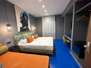 Postel nebo postele na pokoji v ubytování Sorrento Rooms Deluxe