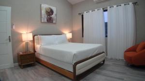 מיטה או מיטות בחדר ב-Golden Pear Villa