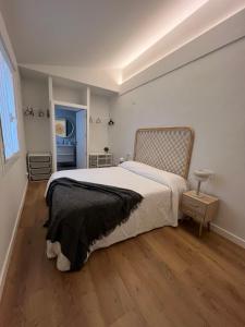 a bedroom with a large bed in a room at Casa Las Pozas in Olite