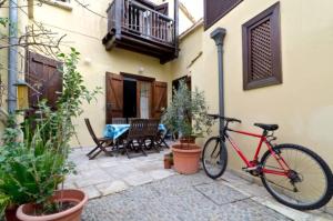 a red bike parked next to a building at Historical House in the Old City of Nicosia in Nicosia