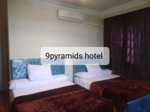 Кровать или кровати в номере 9pyramids hotel