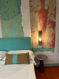 Postel nebo postele na pokoji v ubytování Sorrento Rooms Deluxe