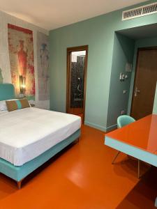 Postel nebo postele na pokoji v ubytování Sorrento Rooms Deluxe
