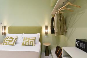 Postel nebo postele na pokoji v ubytování Sorrento Rooms Deluxe