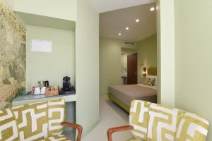 Postel nebo postele na pokoji v ubytování Sorrento Rooms Deluxe