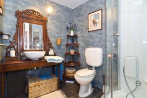 a bathroom with a toilet and a sink and a shower at Studio in the Old City of Nicosia in Nicosia +3 photos