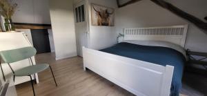 Ένα ή περισσότερα κρεβάτια σε δωμάτιο στο 't Kesselke