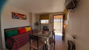 a living room with a couch and a table at La Chakana in Uspallata