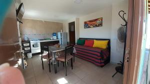 a living room with a couch and a table at La Chakana in Uspallata