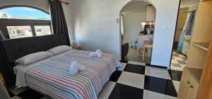 Postel nebo postele na pokoji v ubytování Primordial Apartment