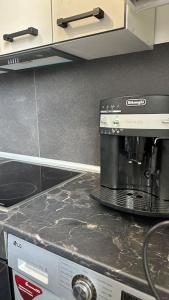 a coffee maker sitting on top of a counter in a kitchen at Apartment for rent in Căușeni 2 in Căuşeni