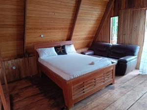 Letto o letti in una camera di Kribi-Lodge