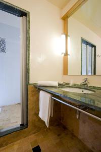 a bathroom with a sink and a mirror at Ibis Marrakech Palmeraie in Marrakesh