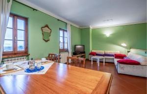 a living room with a table and a couch at Beautiful Apartment In Monte San Savino With Kitchen in Monte San Savino