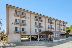 a large building with a parking lot in front of it at Comfort Inn Monterey Park - Los Angeles in Monterey Park