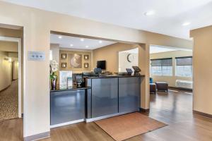 a lobby with a bar in the middle of a room at Comfort Inn Monterey Park - Los Angeles in Monterey Park