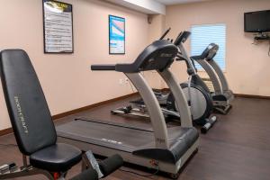 a gym with two exercise bikes in a room at Comfort Inn & Suites Patriots Point in Charleston