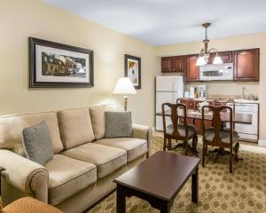 a living room with a couch and a table and a kitchen at Bluegreen Vacations Patrick Henry Sqr, Ascend Resort Collection in Williamsburg