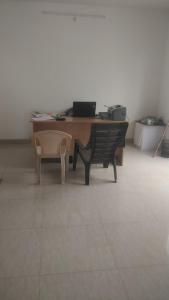 an office with a desk with a chair and a table at Gardenia Groove Villa, Ramky Discovery City in Maisaram
